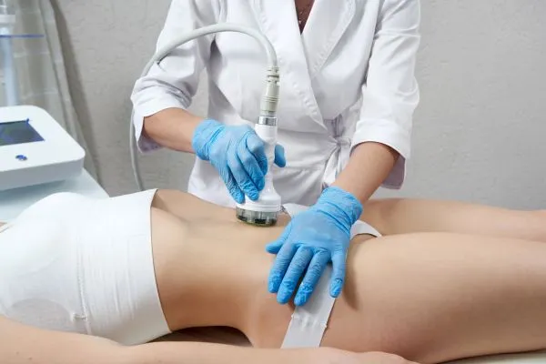 Lost the Weight but Not the Loose Skin? 2 woman having HIFU treatment on her stomach to combat loose skin Bletchley following weight loss